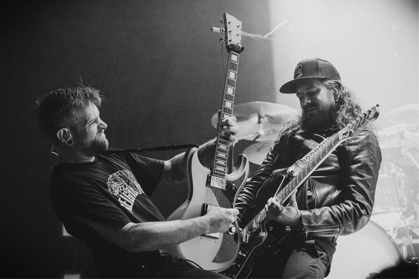 Two members of The Devil Wears Prada's band.